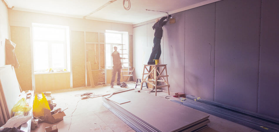 Workers Are Installing Plasterboard (drywall) For Gypsum Walls In Apartment Is Under Construction, Remodeling, Renovation, Extension, Restoration And Reconstruction.